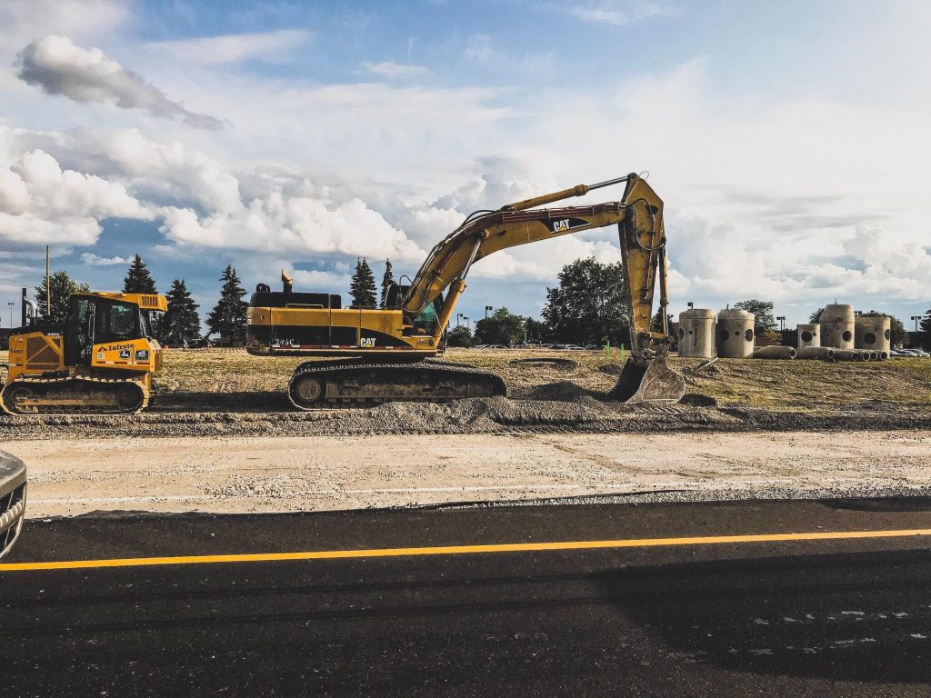 digger and construction vehicle on job site