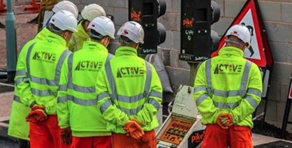 Road mechanics wearing high visibility jackets