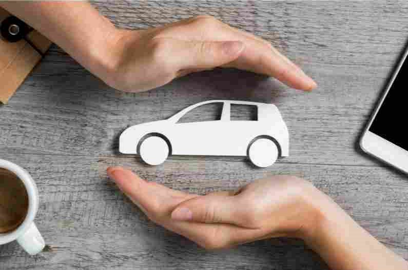 hands framing a vehicle fleet vehicle insurance company car care