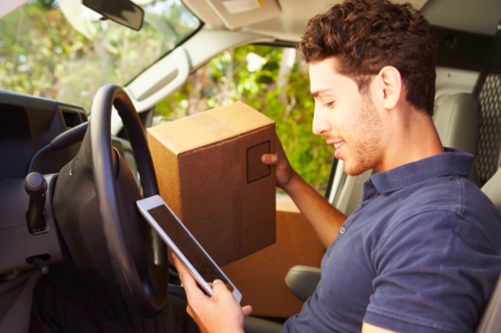 A van driver on his tablet