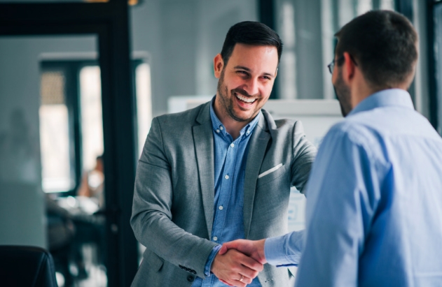 Two employees shaking hands