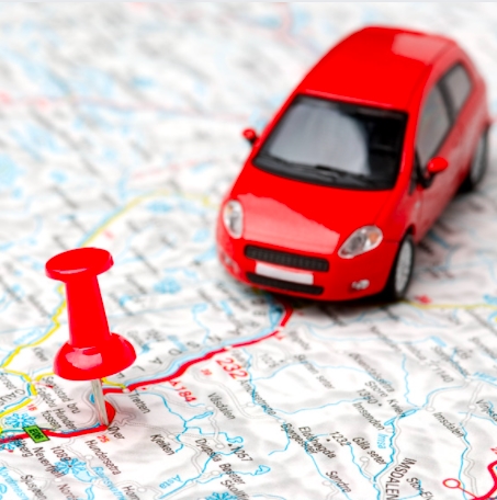 A red vehicle on a map with car tracker fitting